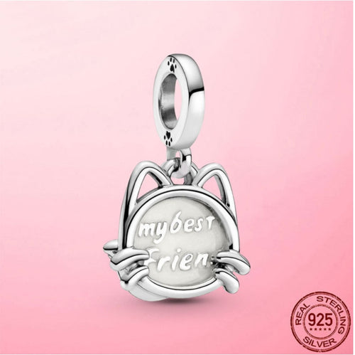 Silver cat charm with text my best friend inside a round frame.
