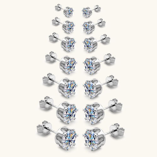Seven pairs of silver stud earrings with sparkling round cubic zirconia stones, arranged by size from smallest to largest.