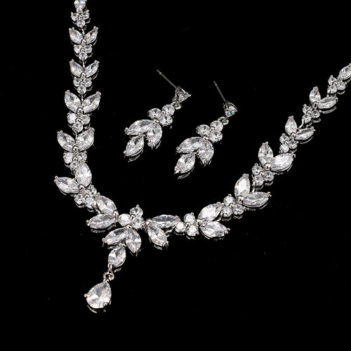 Silver bridal jewelry set featuring marquise-cut cubic zirconia stones in leaf and drop designs.