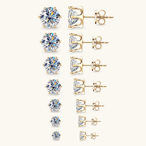 Seven gold stud earrings with round, faceted clear stones in descending sizes, shown from front and side.