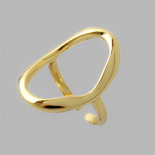 Polished gold-colored metal ring with an organic, asymmetric shape featuring a hollow open loop.
