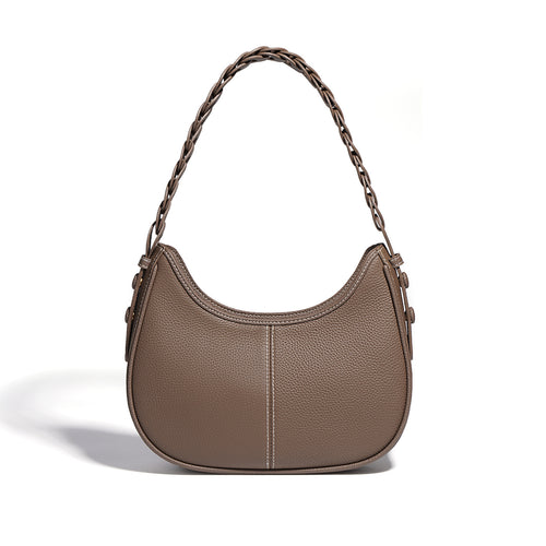Brown leather hobo shoulder bag with a curved shape, braided strap, and contrast white stitching.