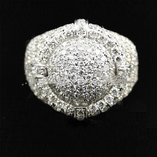 Silver men's ring paved entirely with small round diamonds in a wide, circular cluster design.